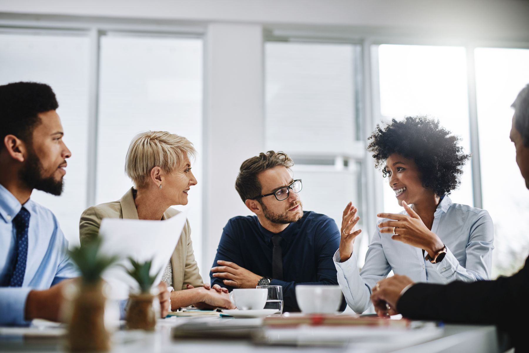 Shot of a group of businesspeople sitting together in a meeting