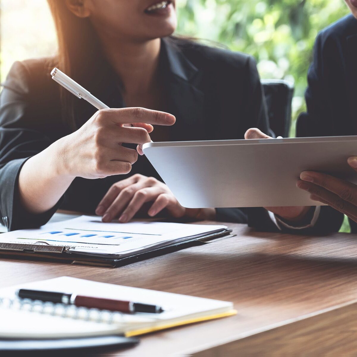 Fund managers team consultation and discuss about analysis Inves Fund managers team consultation and discuss about analysis Investment stock market by digital tablet.