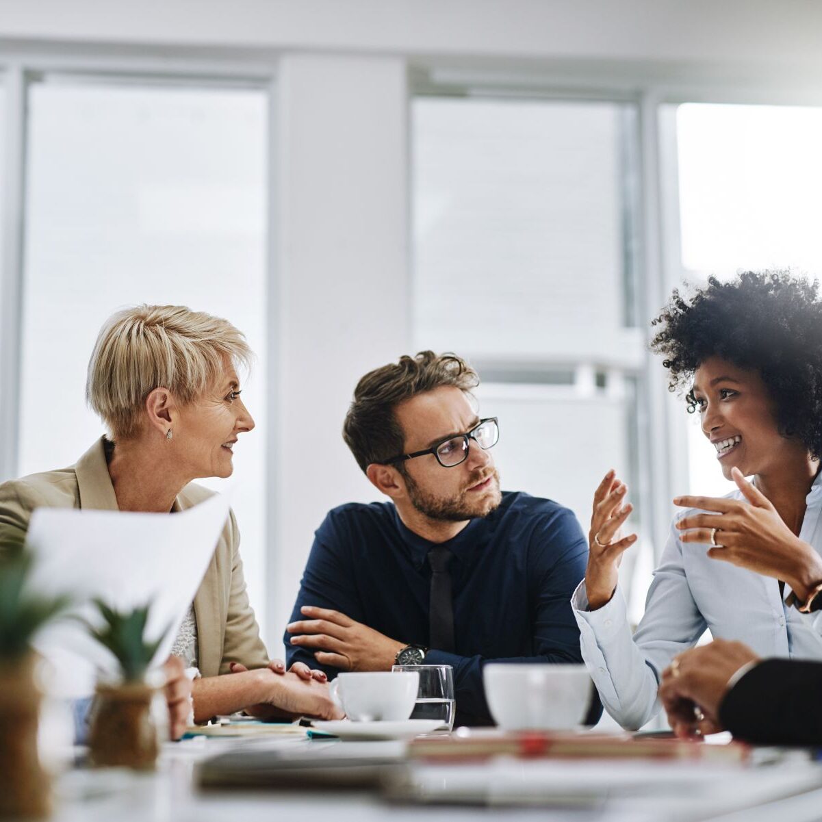 I need everyone to give me their best ideas. Shot of a group of businesspeople sitting together in a meeting. Shot of a group of businesspeople sitting together in a meeting